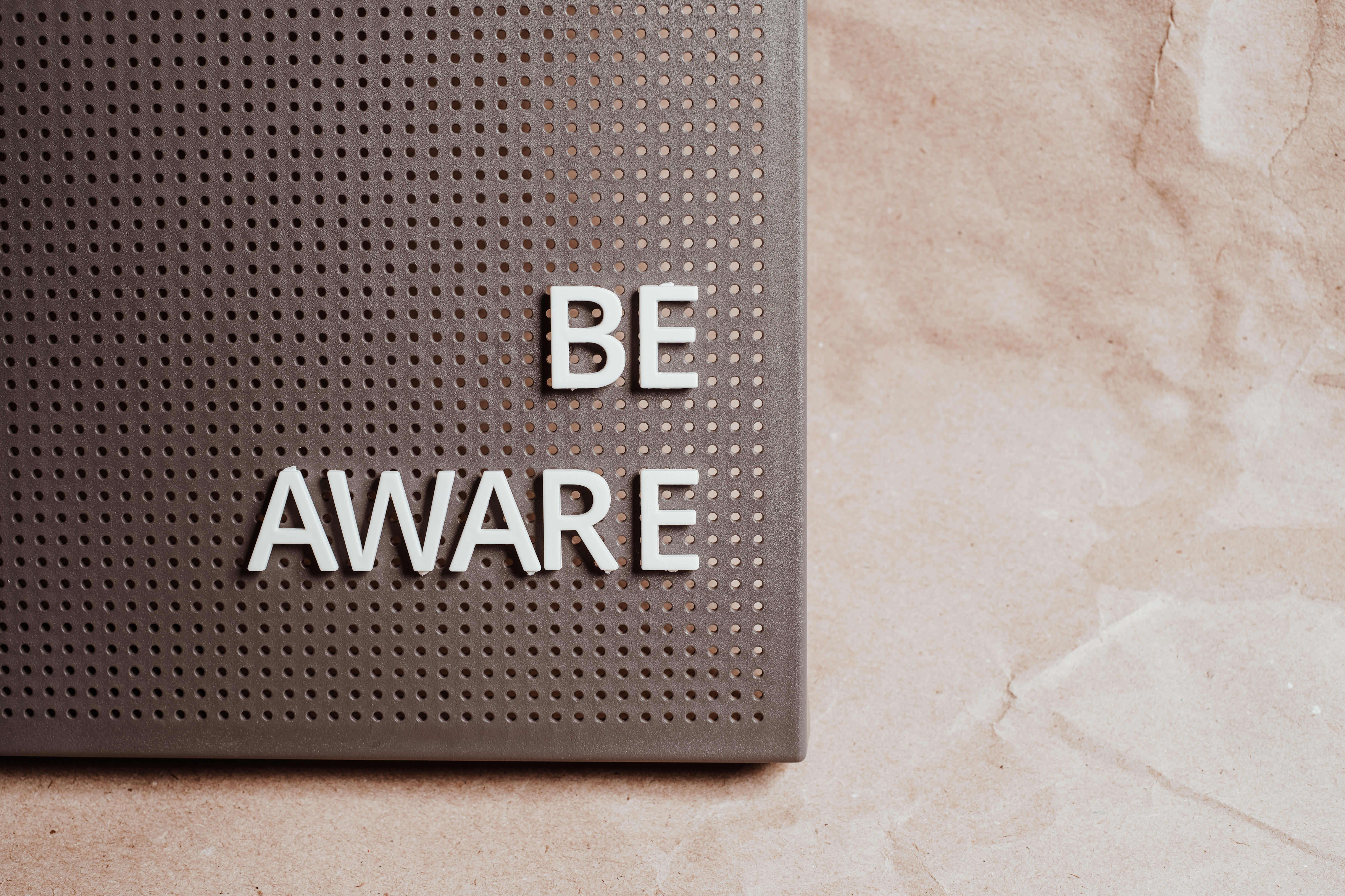 Sign that reads "Be Aware"